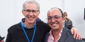 Two are smiling to the camera