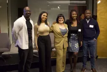Group of people standing together smiling